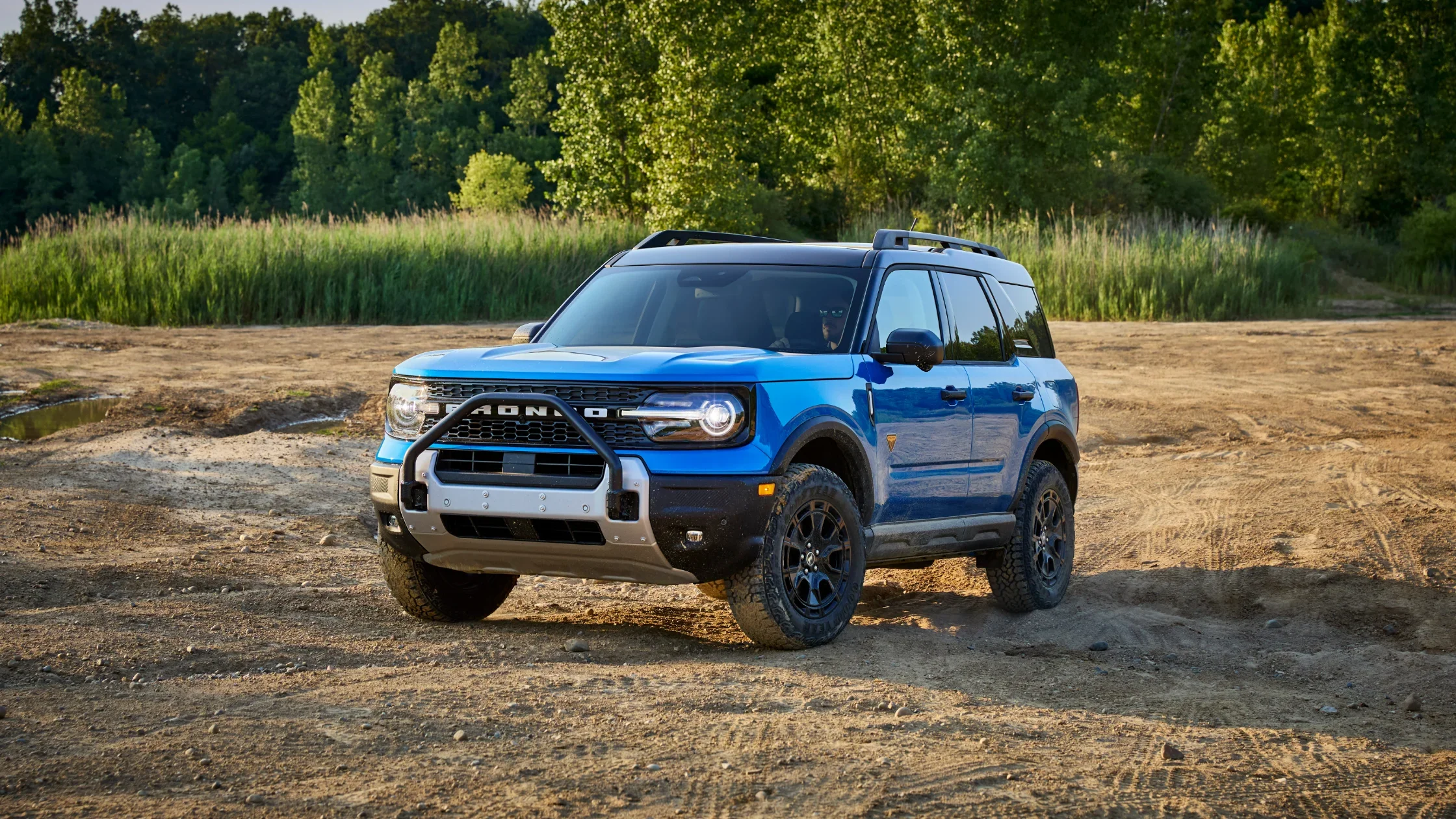 Front view of the 2025 Ford Bronco® Sport off-road SUV with bash plate and rugged tires