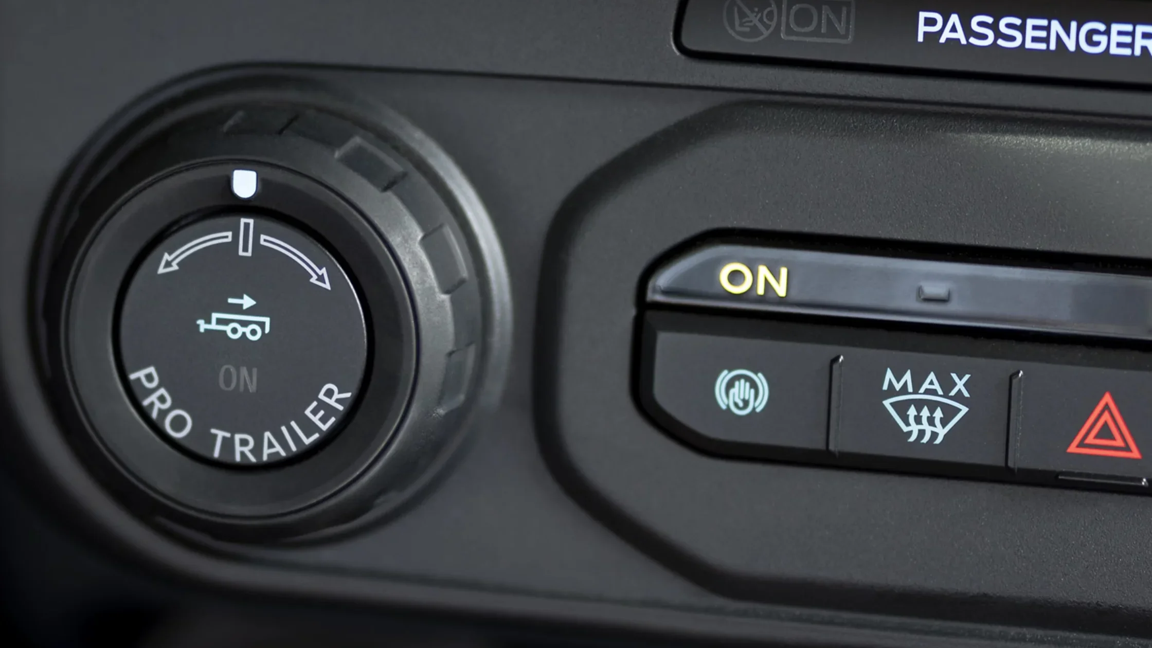 Close-up of Pro Trailer Backup Assist knob and climate control buttons in the 2025 Ford Maverick® dashboard.
