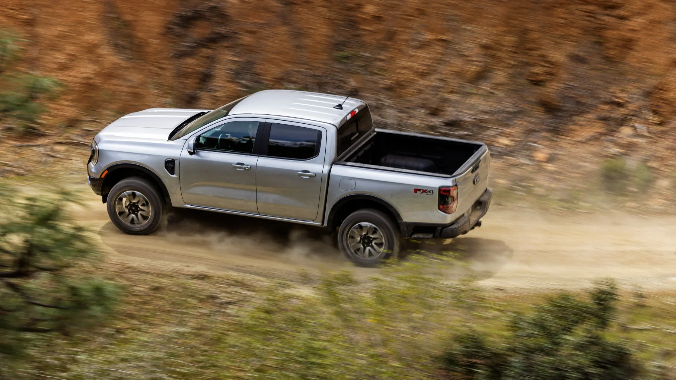 2025 Ford Ranger® FX4 Off-Road pickup in motion on a dirt trail, viewed from above